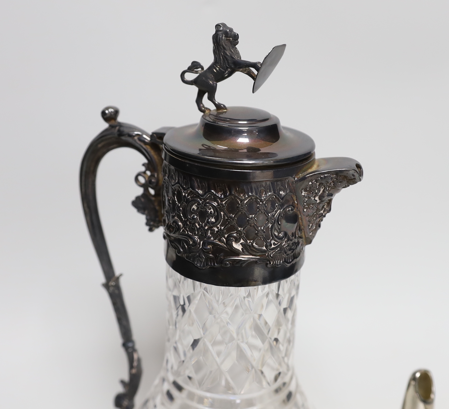 A plated claret jug and wine funnel, 31cm